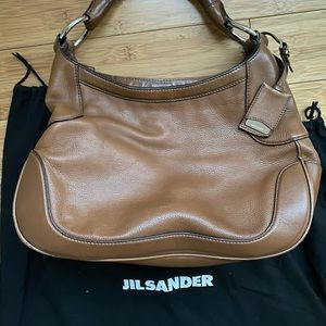 Jil Sander caramel leather bucket bag.